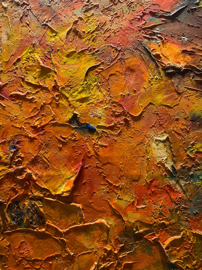 Colorful and textured abstract oil painting with vivid orange tones.